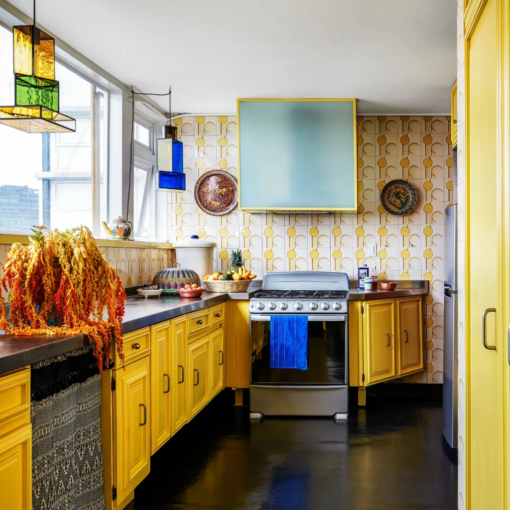 Bold and colorful chimney design as a focal point in the kitchen